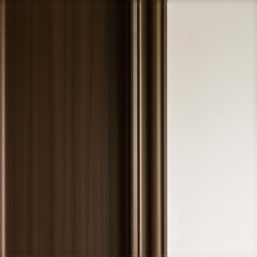 Close-up of a hand sanding a dark wooden trim before painting